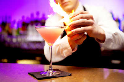 Cocktail, cosmopolitan, orange peel, flame